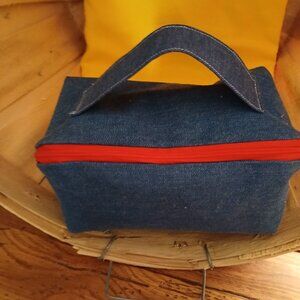 Denim pencil, makeup case, travel bag for toiletries.
